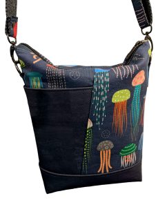 A handmade teloujay crossbody bag featuring a colorful jellyfish motif