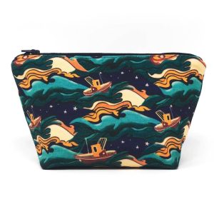 a handmade recycled canvas nasyow zipper pouch featuring a design with boats on a stormy ocean