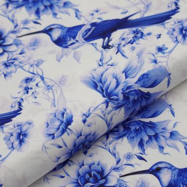 Water resistant cotton canvas with a blue bird and flowers print design