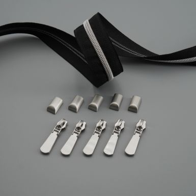 Picture of silver zip tape, zip pulls and zip ends